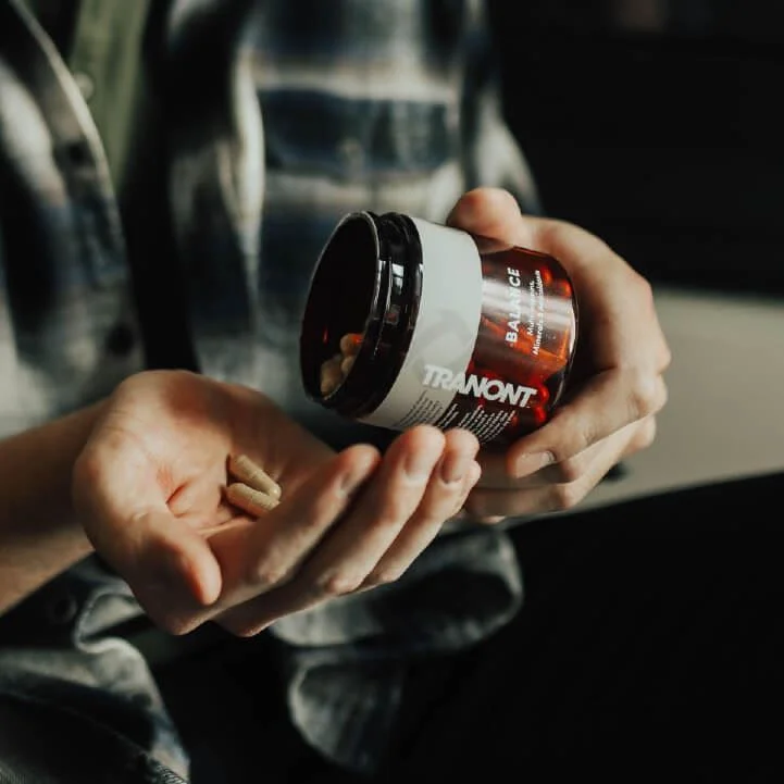 balance pills being poured into hand