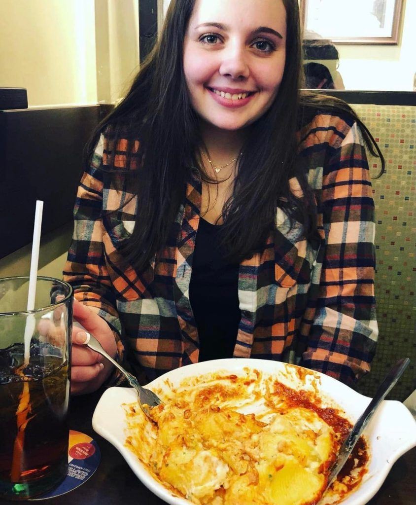 Photo of women enjoying a bowl of pasta after using Enrich digestive enzymes