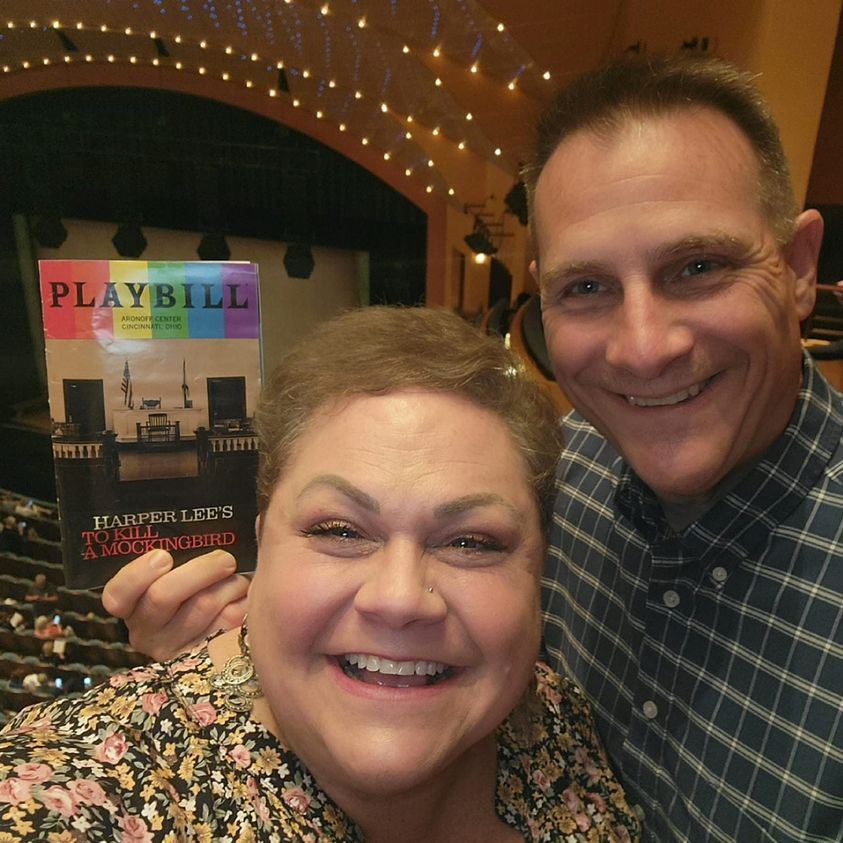 photo of husband and wife at a theater