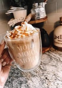 Picture of a cup of Mojo coffee replacement with whipped cream & caramel sauce