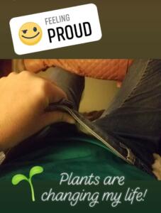 woman showing that she is losing a bunch of weight