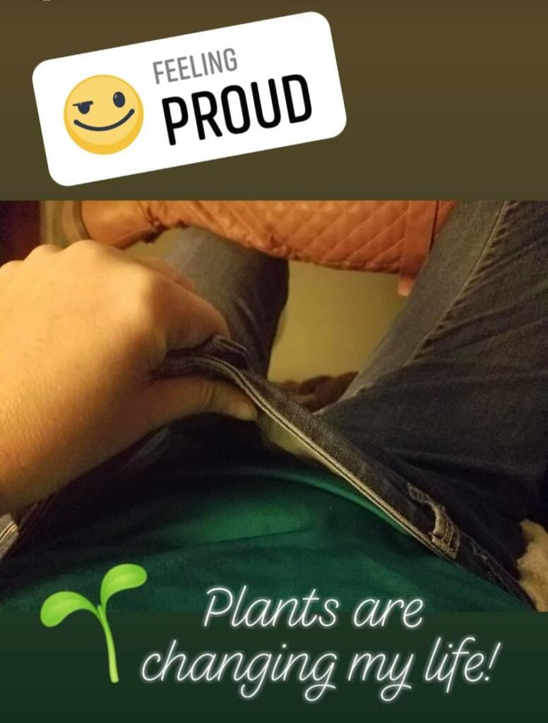 woman showing that she is losing a bunch of weight